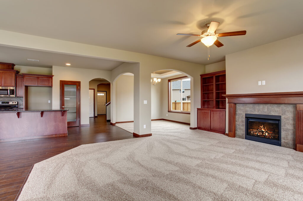 Carpet Flooring in a large living room opening into the kitchen | Nampa Floors & Interiors