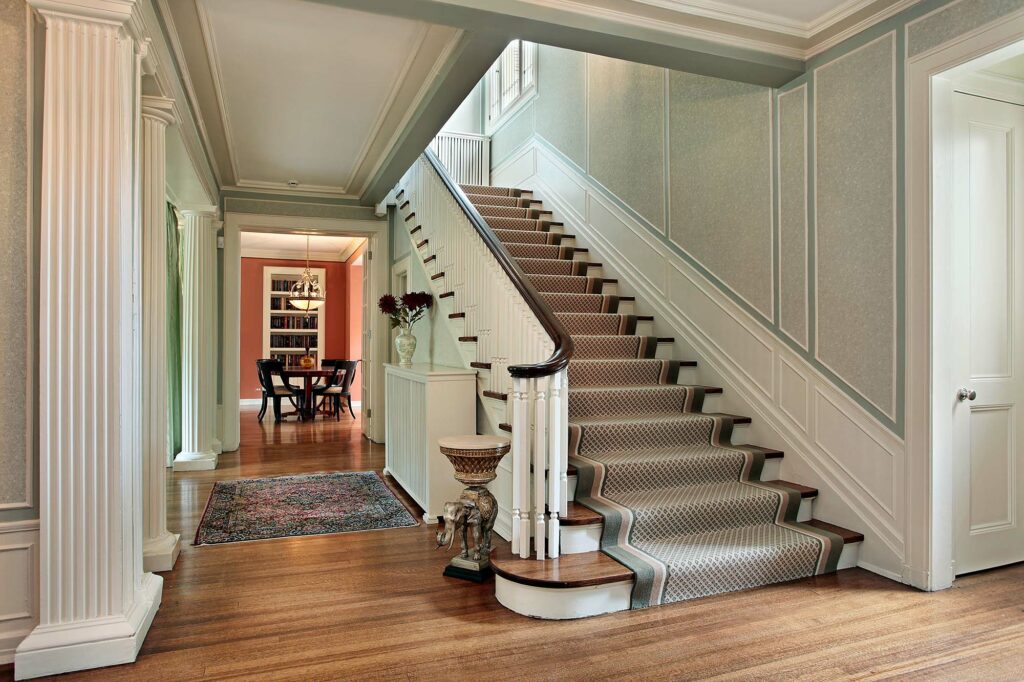 hardwood stairs with carpet runner in multi-level townhouse